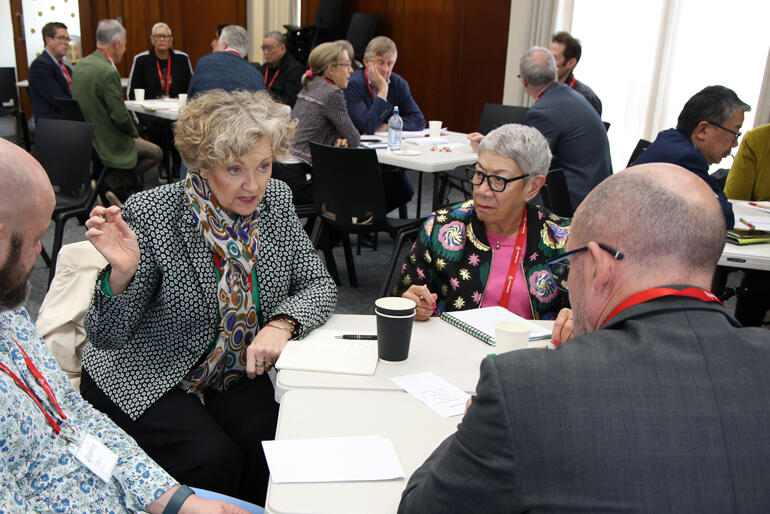 Ainsley McLaren of the Melanesian Mission Trust Board shares ideas as Ani Waaka from the Diocese of Wellington looks on.