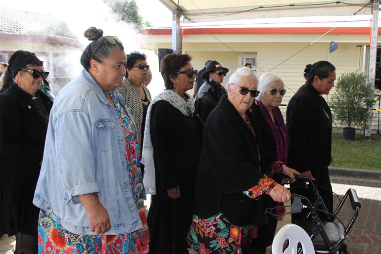 Mrs Mihi Turei turns as she leads the manuihiri onto the marae at Ohinemutu on 12 April 2025.